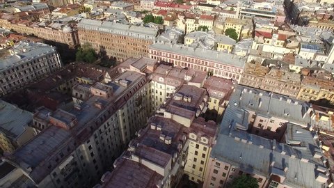 Aerial flight over Saint Petersburg center downtown. View of sightseeing from above. Unique footage. Rooftops and road traffic.