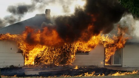 House on fire burning during a controlled burn in Idaho.