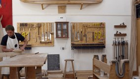 Carpenter And Apprentice Make Surfboards Shot On RED Camera - Powered by Shutterstock - Get 15% off with code: PIKWIZARD15