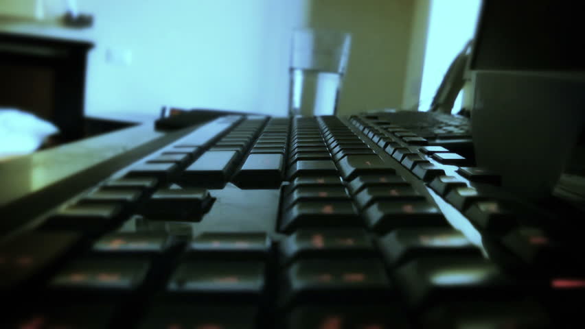 Typing on Computer Keyboard, time lapse, flash and zoom