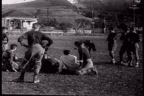 Martinez California\xCDs local high school football team practices in 1927. (1920s)