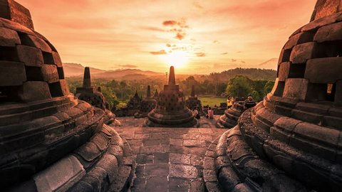Buddist temple Borobudur at amazing sunset in Indonesia. 4K Timelapse - Java, Indonesia, June 2016.