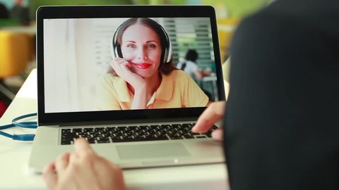 woman doing videocall using laptop