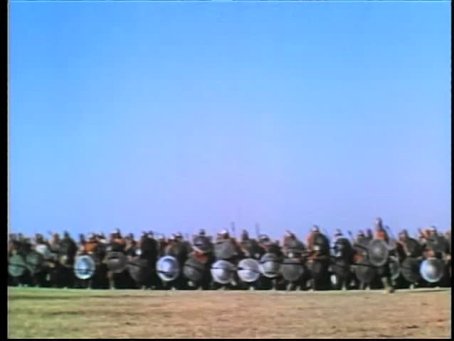 Wide shot medieval soldiers on the attack