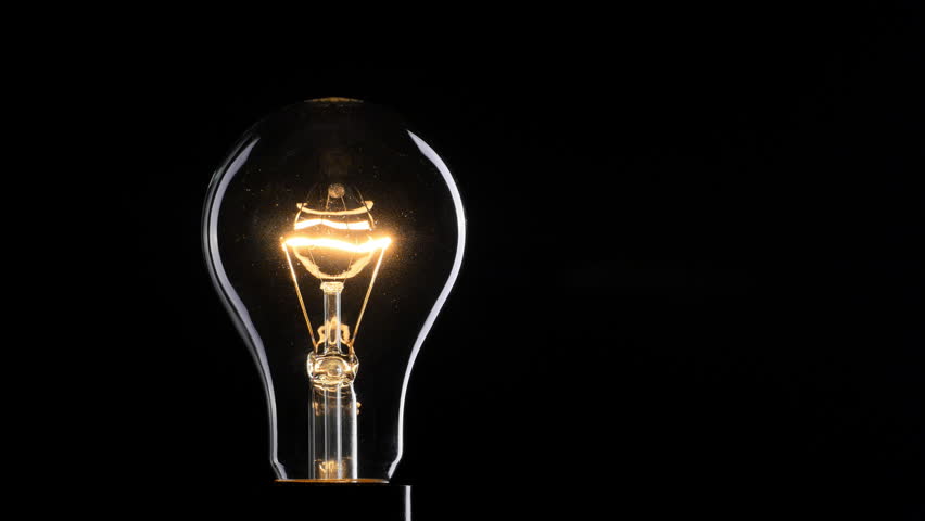 Flashing Light Bulb Over Black Stock Footage Video 100 Royalty Free
