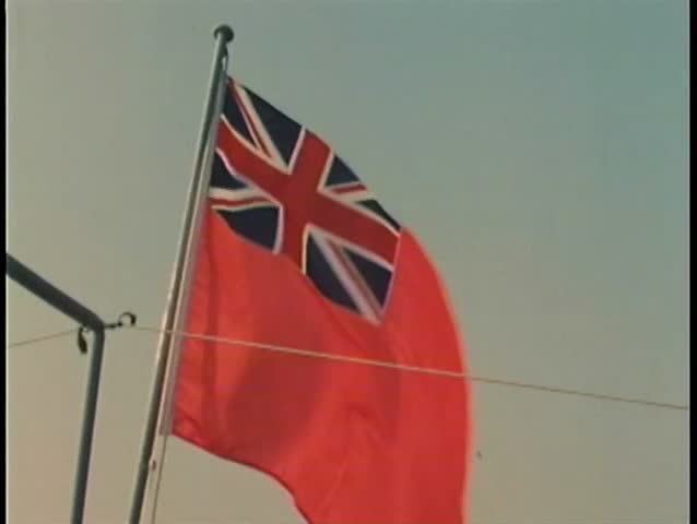 Lowering British Navy flag and raising Spanish flag