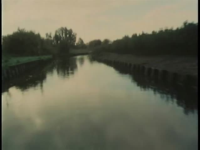 View from motorboat moving through marsh