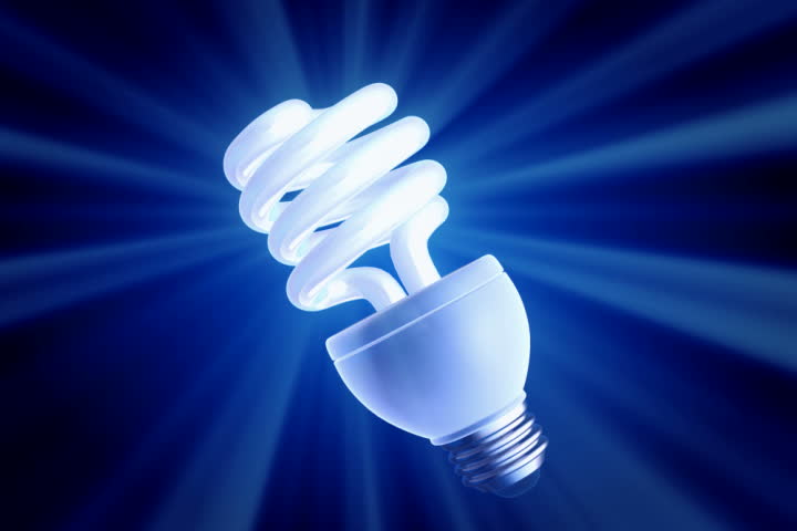footage of a spiral shape CFL light in blue background 