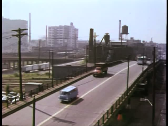 Cars and trucks crossing bridge