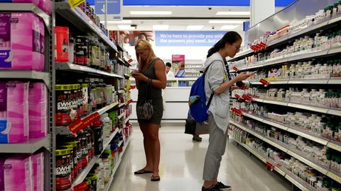 Coquitlam, BC, Canada - July 29, 2016 : People choosing health foods at pharmacy section inside Walmart store with 4k resolution