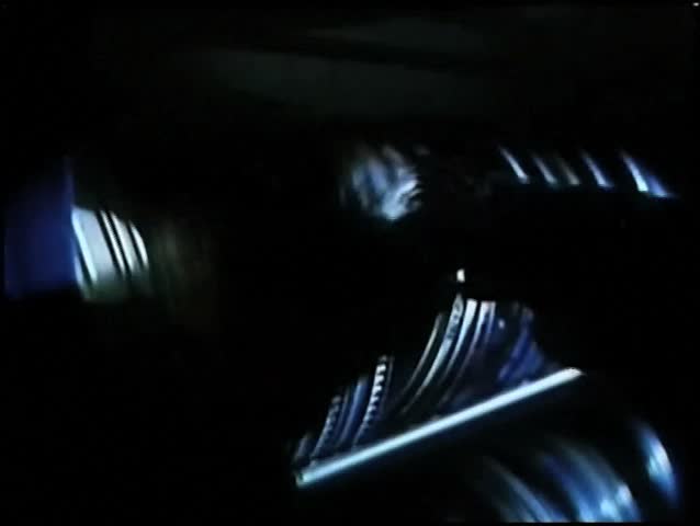 Gloved hands going through film reels