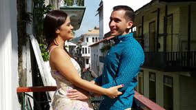 Young couple in love outdoor in the balcony