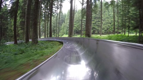 Downhill with summer bobsleigh. Spiazzi di Gromo. Orobie area. Valle Seriana. Bergamo. Italy.