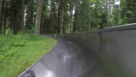Downhill with summer bobsleigh. Spiazzi di Gromo. Orobie area. Valle Seriana. Bergamo. Italy.