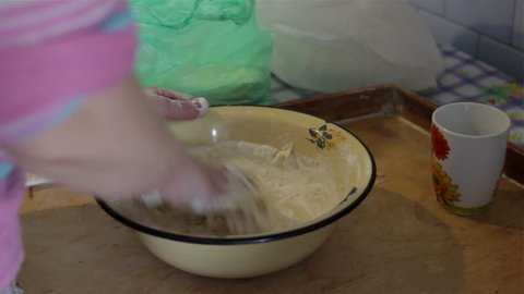 Knead dough in bowl/woman hands knead dough in bowl