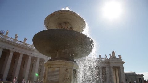 Sacred Fountain of Saint Peter square with roman columns, in Rome, Italy for jubilee year.