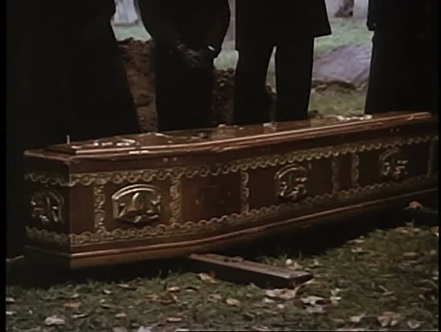 Coffin on ground in cemetery