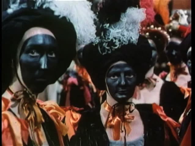 People with painted faces at costume ball