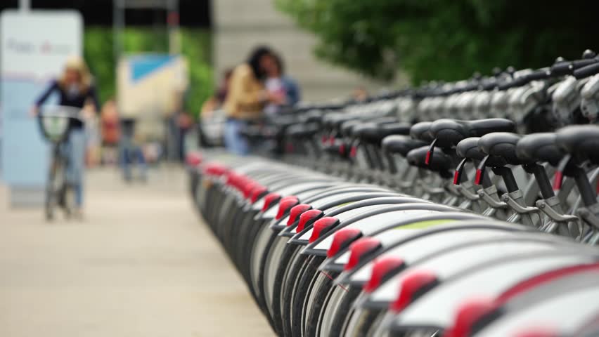 Large number of parked bicycle for rent in the city, public transportation 4K