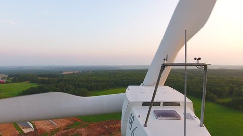 Aerial View. Beautiful windmill turbines sunset , wind energy turbines . Aerial drone shot. 4K 30fps