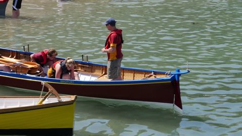 photo Bailing Water Out Of A Boat men bailing stock footage video