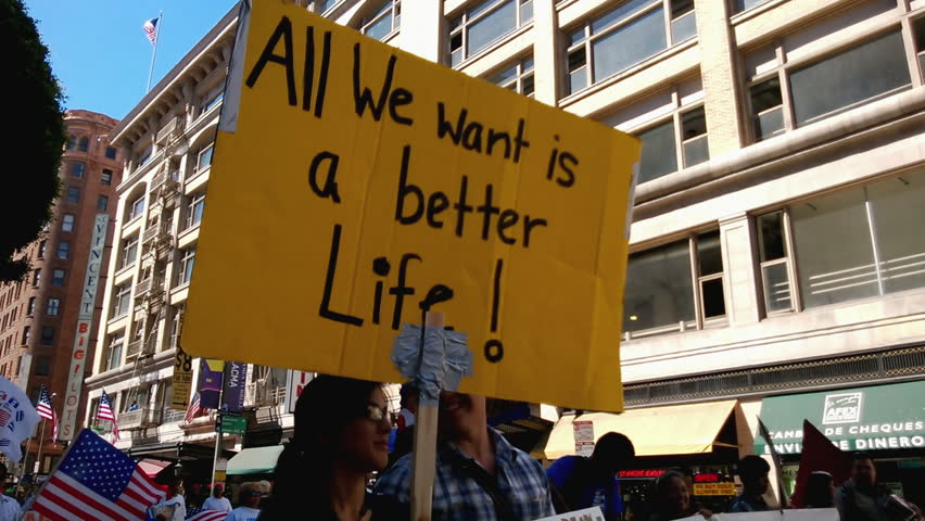 "A Better Life" Rally Sign. A large yellow picket sign that reads, "All We Want Is A Better Life!" is held up during an immigration rally in downtown Los Angeles on September 22, 2013.