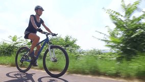 Young woman riding her mountain bike
