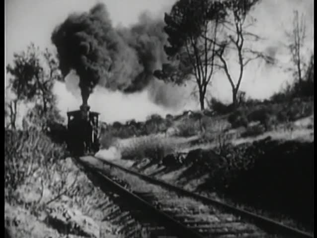 Locomotive coming down railroad track
