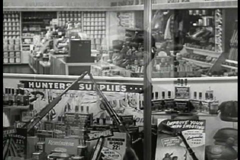 Inside an American businessman\xEAs sporting goods store and window display in 1947. (1940s)
