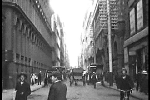 A look at Little Collins Street foot traffic, horse and buggies, and men\xEAs fashion in Melbourne, Australia in 1910. (1910s)