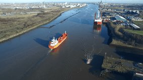 Aerial drone video of red ships and boats on River Tees in Middlesbrough