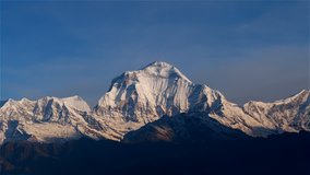 Aerial view of Himalayas Nepal mountain peak. Time-lapse 4k video nature, background. Twilight sunrise and clear sky.