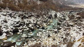 Mountain river flowing in Himalayas Nepal. Water falling through rocks. Snow nature travel background hd video.