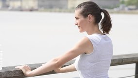 Jogger woman drinking water after exercising