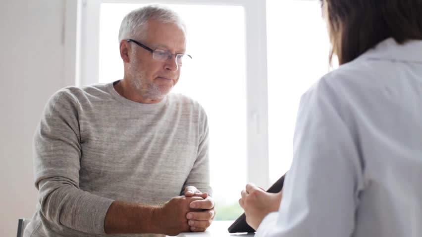Medicine, age, health care and people concept - senior man and doctor with tablet pc computer meeting in medical office at hospital | Shutterstock HD Video #18457792