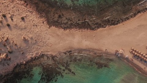 Aerial view from the popular tween beach at Elafonisos Island in Peloponnese, Greece. A double-mirrored-gulf beach surrounded by vivid water in an unrealistic way.