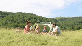 Family of four in camp tent