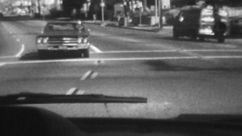 Vintage super 8 black and white time lapse driving shot on Riverside Dr and Figueroa St in Los Angeles, California. 