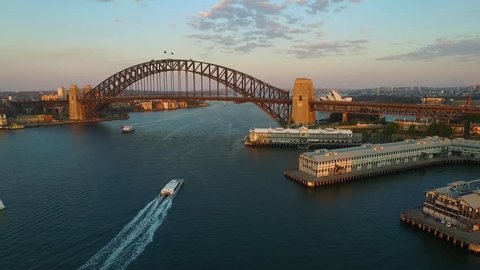 Aerial footage of Sydney Harbour Bridge, from helicopter featuring Sydney CBD, Sydney Ferries (ferry), with Sydney Skyline in Background & Ferries in Foreground, on the Parramatta River.