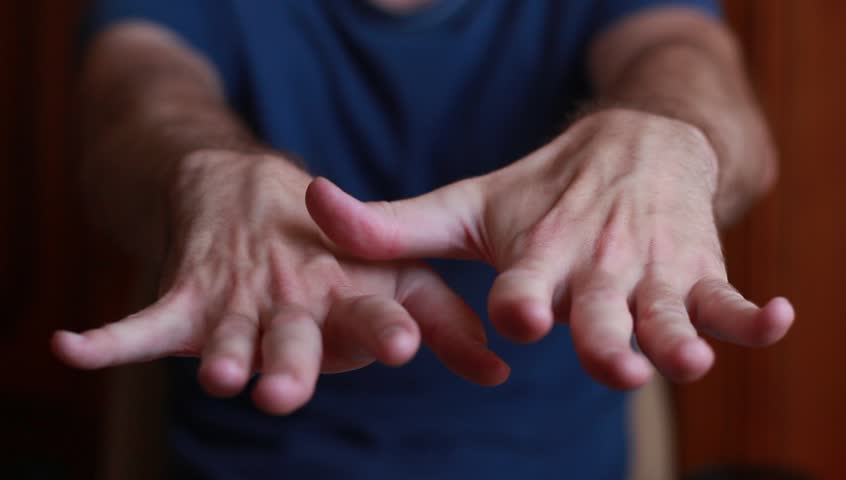 Man with tremored hands | Shutterstock HD Video #18490657