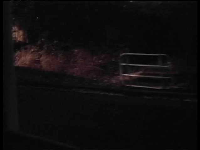 View from train traveling past waterfalls
