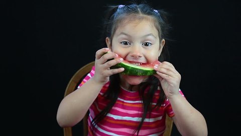 Happy watermelon child eating a slice of watermelon - HD