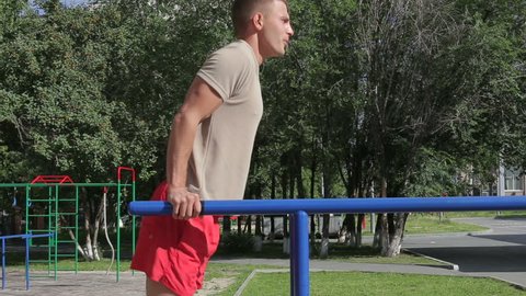 Athletic man exercising outdoors, workout