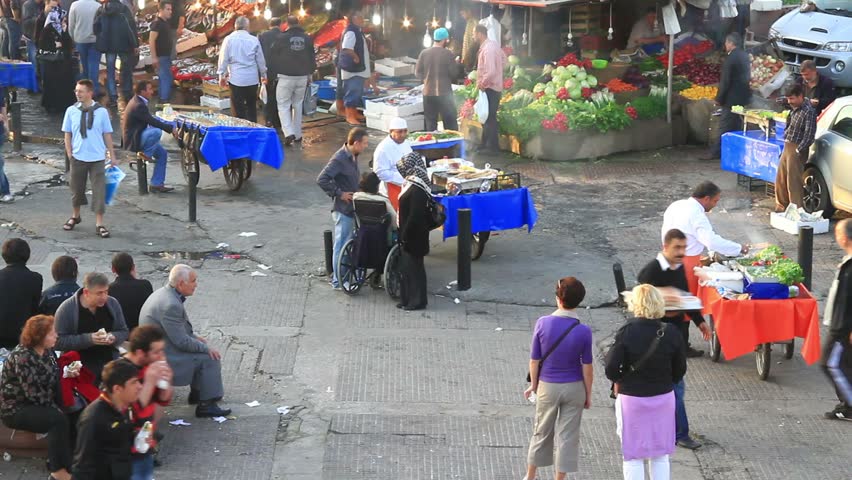 ISTANBUL - NOVEMBER 13: People buy and eat fish at Karakoy street market on