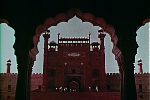 The Badshahi Mosque in Lahore Pakistan in 1962, it\xEAs art forms inside, Pakistani men, and the influence of the Islamic faith. (1960s)