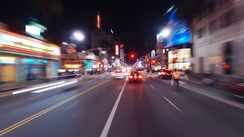 Hyperlapsed view from a car at night. POV. Hollywood, Walk of Fame. Los Angeles, United States. Perfect to represent concepts as autonomous driving, futuristic cityscape, city life, etc. 

