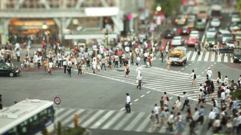 Thousands of people walk across the famous Shibuya Crossing in Tokyo Japan
