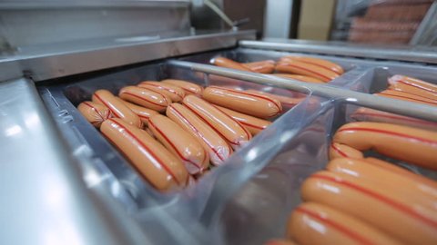 packaging sausage on production