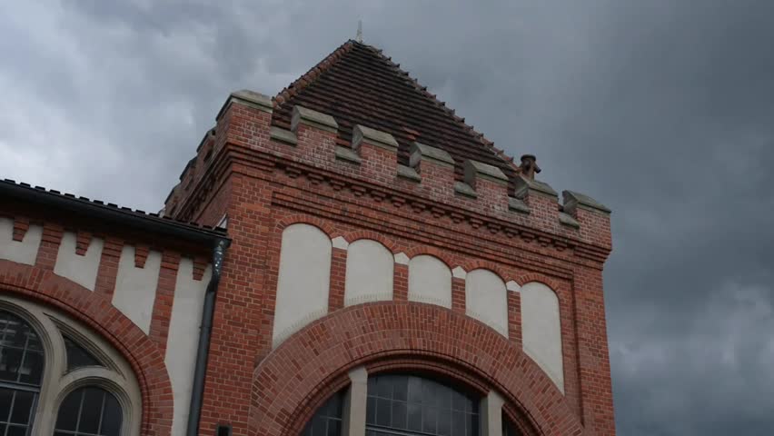 Old building of red brick. Bydgoszcz (Bromberg, Bydgostia) is a city located in northern Poland, on the Brda and Vistula rivers.