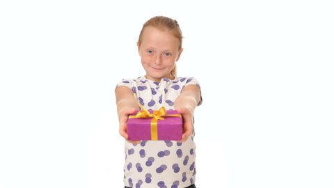 Happy little redhead girl giving holiday present box, white background